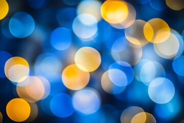 Abstract bokeh background with blue and yellow lights.