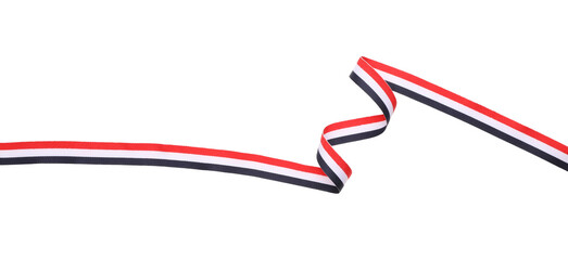 Fototapeta premium Ribbon in colors of Yemeni flag isolated on white, top view