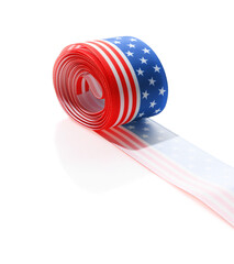 Obraz premium Roll with ribbon in colors of American flag isolated on white
