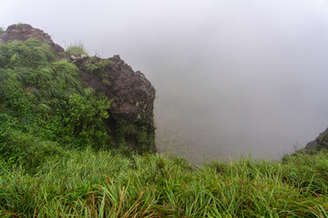 Foggy view of valley from Mount Batur hike, as seen from an early morning walk climbing up the mountain in Bali, Indonesia.