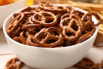 Delicious salty pretzel crackers on table, closeup