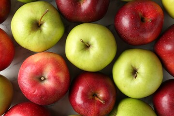Ripe red and green apples on table, flat lay