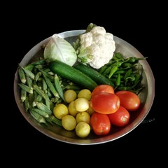 fresh vegetables on a black background, showcasing verity a vegetables