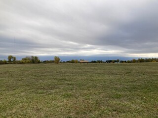 field and sky with clouds