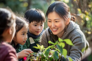 Teacher and her students are smiling while learning about plants in a forest school