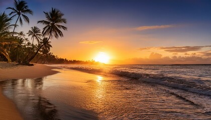 beautiful sunrise over tropical beach and palm trees in dominican republic