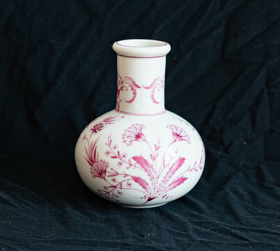 Victorian-Style Porcelain Vase with Purple Hand-Painted Floral Pattern &ndash; Isolated on Black Background