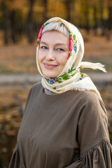 Russian beauty - young beautiful woman in a traditional headscarf