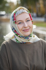 Russian beauty - young beautiful woman in a traditional headscarf