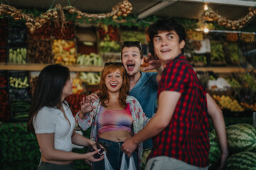 A group of friends enjoying a day out at a greengrocer, selecting fresh, vibrant fruits and vegetables. They are interacting and smiling, showcasing a fun shopping experience.