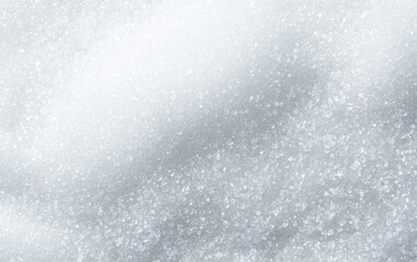 Obraz premium Fine white sugar texture in a macro shot, suitable for food and beverage promotions, cooking recipes, or ingredient-focused marketing materials