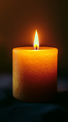 Warm Glow of a Candle Flame in Low Light for Cozy Atmosphere