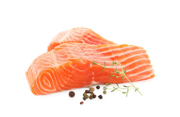 Pieces of fresh salmon, peppercorns and thyme isolated on white