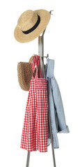 Metal rack with clothes and straw hat isolated on white