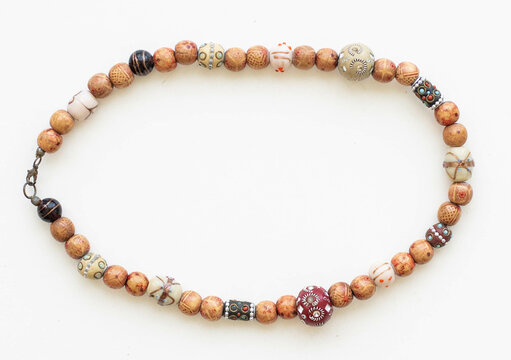 Boho African Style Necklace with Wooden and Glass Beads &ndash; Flatlay on White Background