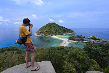 Tourists take photos of the beauty of Koh Nang Yuan from the viewpoint Surat Thani Province,...