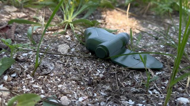Banned Butterfly Mine Lepestok (PFM-1SU) antipersonnel mine lies on ground, used to terrain against enemy manpower. This is pressure-action antipersonnel mine, 'butterfly' used  in Ukraine