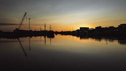 Calm and quiet shipyard with water reflections on a sunset, Brighton and Hove, East Sussex, UK