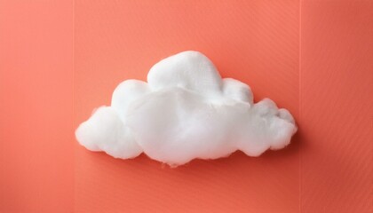 white cloud against pastel coral color background weather minimal concept