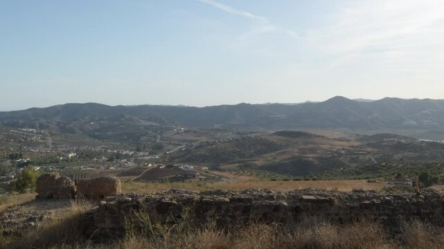 Rests of a wall fortress at sunset, Alcaucin, Spain