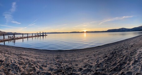 Fototapeta premium Serene Lake and Mountain Landscapes at Sunrise and Sunset