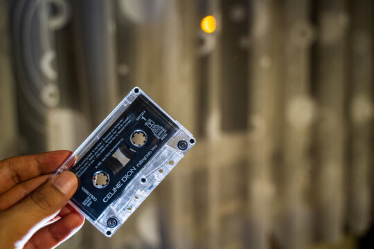 Krakow, Poland - October 13, 2024: Vintage celine dion Audio Cassette on Elegant Lace Fabric Background