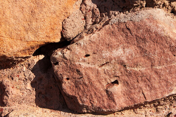 Image of a brown stone wall, masonry.