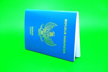 green indonesian passport isolated on green background