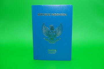 green indonesian passport isolated on green background