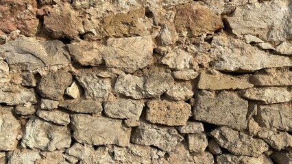 Stone old wall of shell bricks along