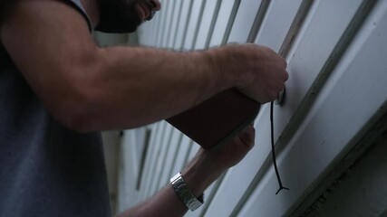 Winterizing series - Man installs foam faucet polar cap cover over spigot