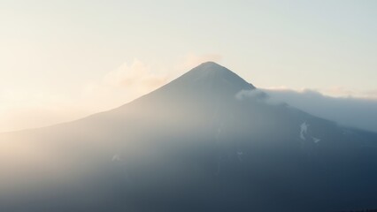 Serene Mountain View with Soft Clouds at Sunrise