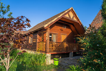Fototapeta premium Wooden hotel cabin in the forest