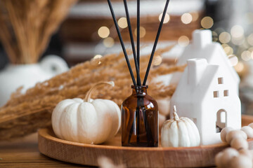 Aroma diffuser. Autumn scented perfumes for the home in a glass bottle with sticks as an air...