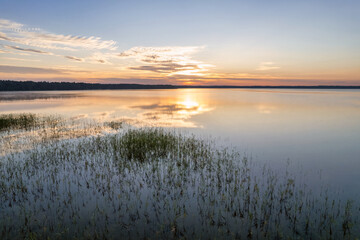 Aerial drone view over sunrise White Lake. Rivne region, Ukraine.