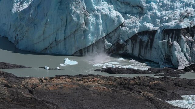 A block of ice carving off of the Perito Moreno glacier