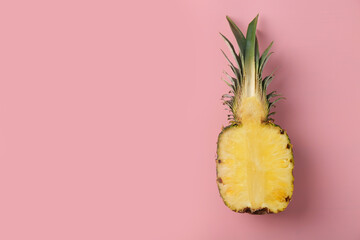Half of fresh pineapple on pink background, top view. Space for text