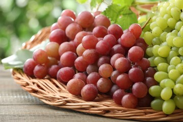 Fresh ripe grapes on wooden table, closeup
