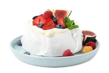 Pavlova cake (meringue dessert) with whipped cream, fresh berries, mint and fig isolated on white