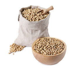 Soy beans in burlap sack, bowl and scoop isolated on white