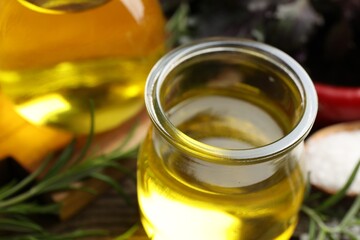Cooking oil in jar on table, closeup
