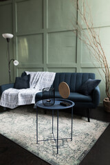 Elegant interior design featuring a modern couch, decorative table, and stylish decor in a cozy living space