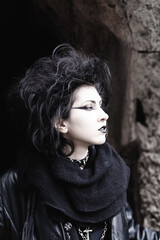 Portrait of Dark gothic fashion youg woman with black makeup, black lipstick and nose piercing....