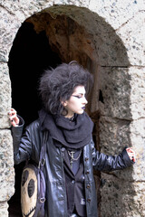 Portrait of Dark gothic fashion youg woman with black makeup, black lipstick and nose piercing. Italian beautiful brunette girl. Dark lady. Dark girl.  Trad goth girl. Close-up photo