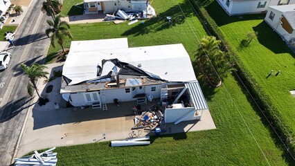 high hurricane Milton wind damage to a mobile home roof in Palmetto, Florida © michael