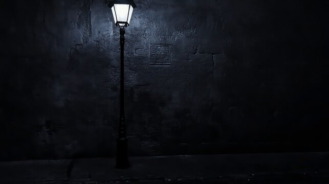 A single street lamp illuminates a dark alleyway with a rough stone wall. - Powered by Adobe
