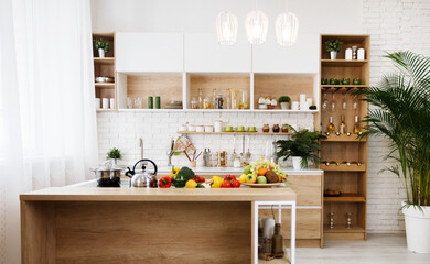 Modern light wooden kitchen with island and big table, free space