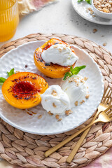 Grilled peaches with honey drizzle, served with vanilla ice cream