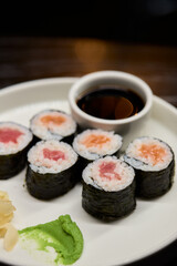 A Beautiful Plate Filled with Delicious Sushi Rolls Accompanied by Soy Sauce for Dipping