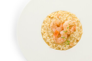 Delicious risotto with shrimps and cheese isolated on white, top view